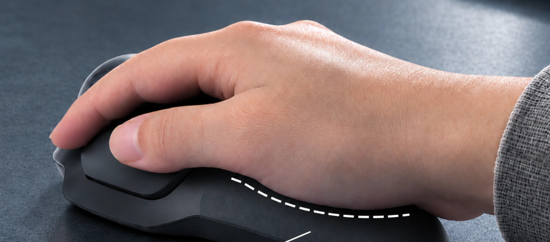 Hand resting on the soft-touch rear surface
